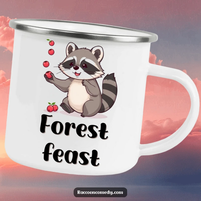 Funny enamel camping mug with a playful raccoon juggling berries, ideal for outdoor humor and showcasing nimble skills.