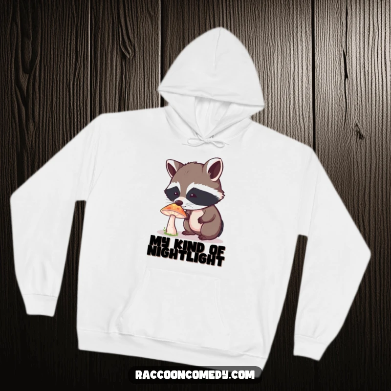 Funny Raccoon Hoodie: A curious raccoon is mesmerized by the glow of a fantastical mushroom, embodying pure wonder.