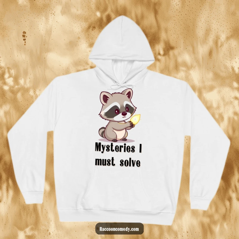 Funny raccoon hoodie depicting a cute character looking curiously at a glowing object, offering warmth and a sense of nocturnal mystery.