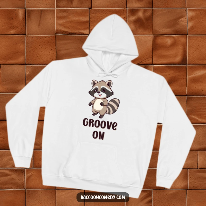 Funny hoodie showing a happy raccoon with a fluffy tail doing a little dance, providing warmth and a touch of infectious joy.