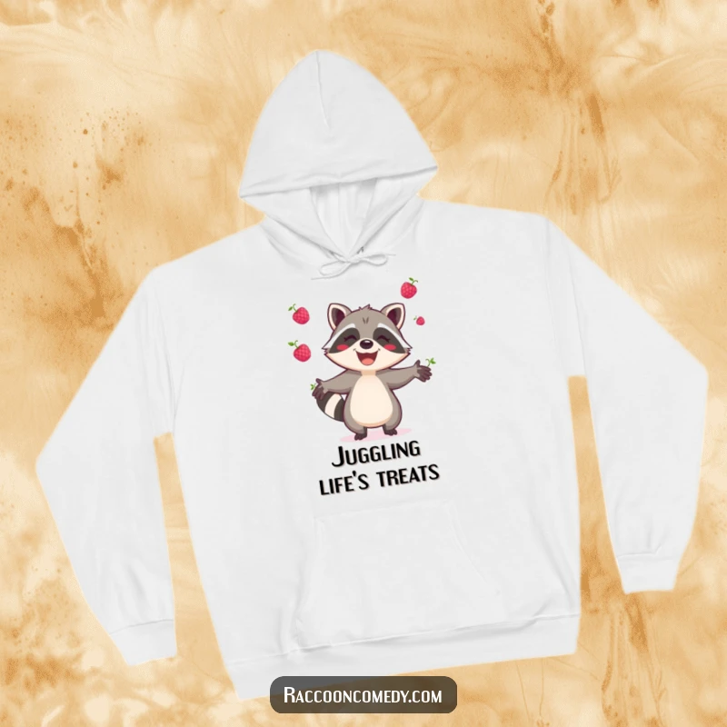 Funny raccoon hoodie, cozy and warm, featuring a joyful raccoon gleefully juggling berries, great for relaxing and smiling.