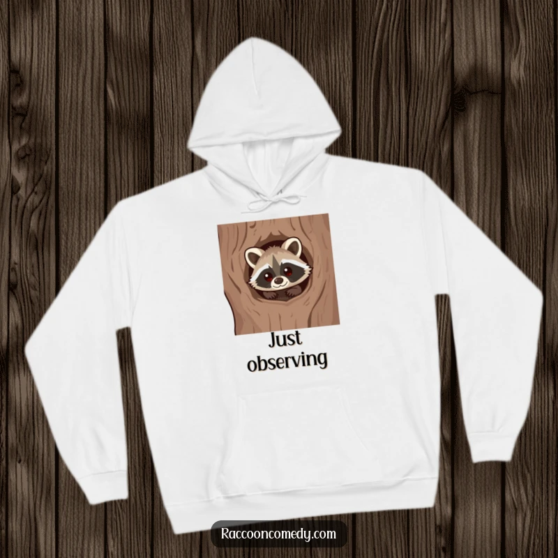 Funny Kawaii Raccoon Hoodie: Cute raccoon with a curious expression peeking from a tree hollow.