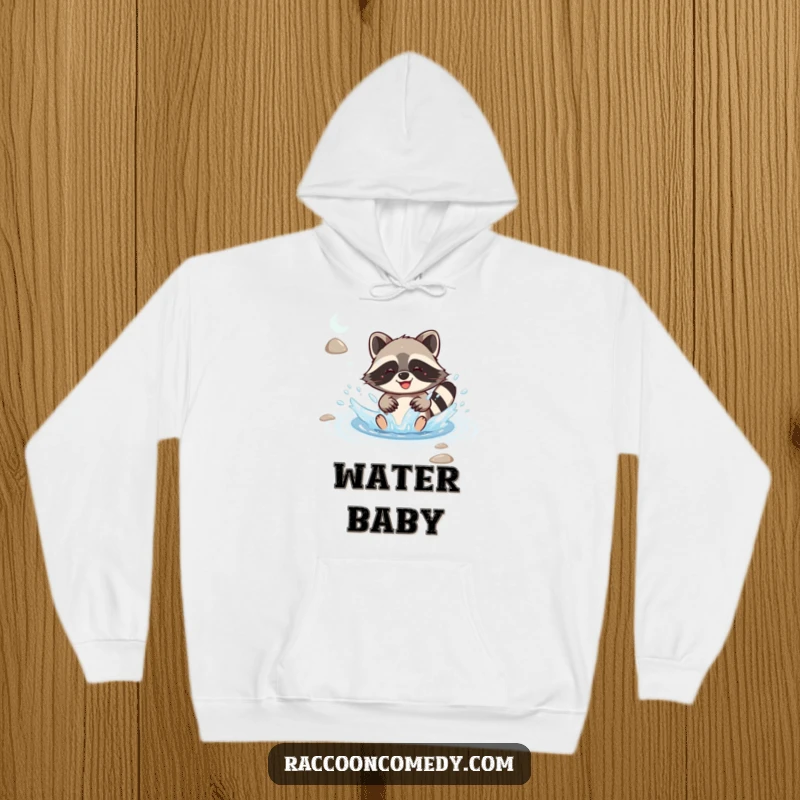 Funny kawaii raccoon joyfully splashing in a stream with delight, featured on a cozy hoodie, perfect for reliving happy moments.