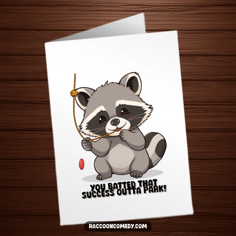 Funny Free Printable Congratulations Card: A kawaii raccoon playfully batting at a string, celebrating a happy milestone with delight.