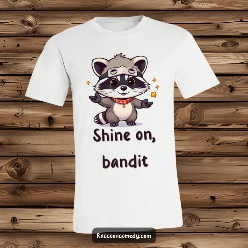 Funny Raccoon T-Shirt: A cute kawaii raccoon in a bandit mask playfully juggling shiny items, full of charm and humor.
