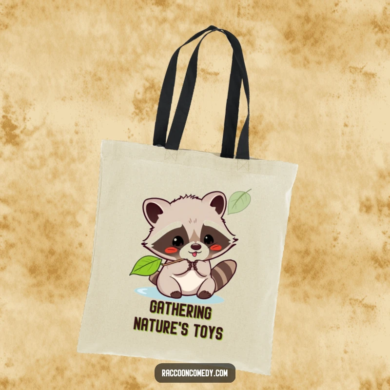 Funny kawaii raccoon playfully batting at a floating leaf, printed on a durable tote bag, perfect for carrying smiles.