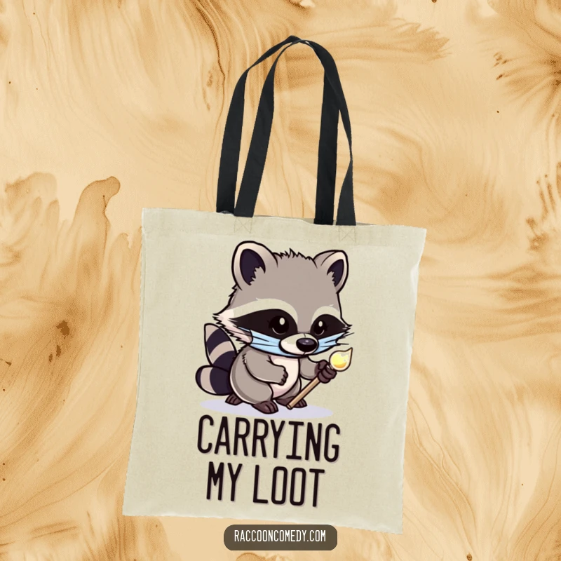 Funny tote bag showcasing a cute, masked raccoon tiptoeing with a stolen shiny object, designed for carrying items with a mischievous flair.
