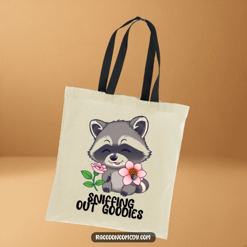 Funny raccoon tote bag with a graphic of a raccoon sniffing a flower, nose twitching, embodying natural curiosity, a practical funny gift.